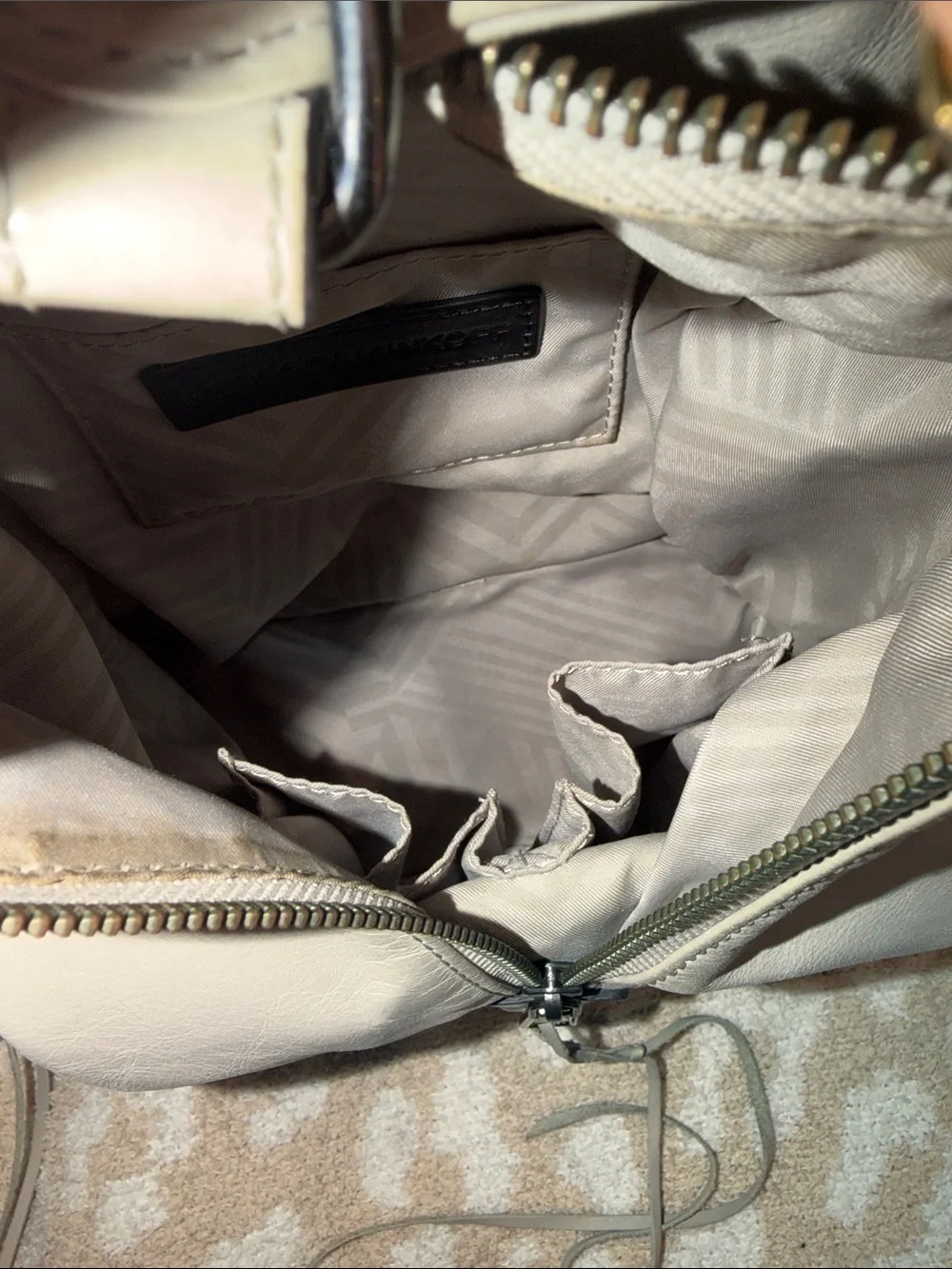 Rebecca Minkoff Ivory Leather Backpack with Gunmetal Hardware slightly worn.